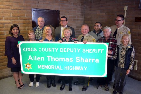 Friends, family, law enforcement, and state lawmakers gather Friday to honor Kings County Deputy Sheriff Allen Sharra Gina Sharra with friends, family, legislators and Kings County officials as her late husband, Deputy Allen Sharra is honored with a Memorial Highway designation.